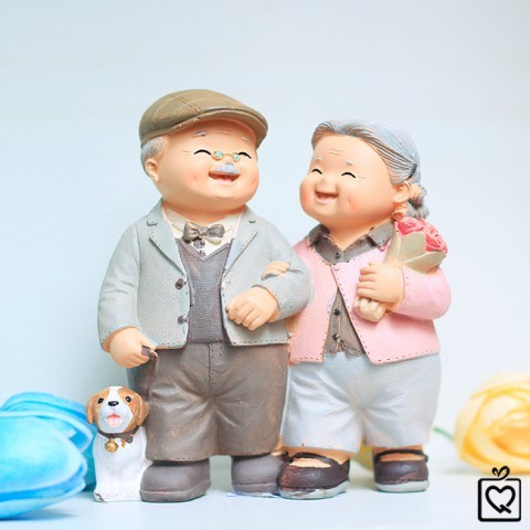 Statue of grandparents - walking a dog